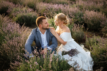 bride and groom on in the lavender field