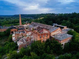 Foto op Plexiglas Ruined overgrown abandoned sugar factory in Ramon, aerial view © Mulderphoto