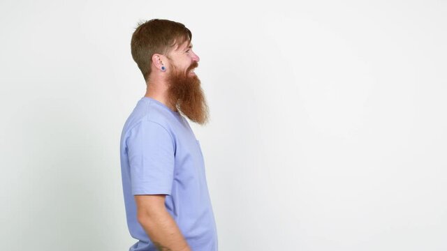 Redhead man with long beard presenting something over isolated background