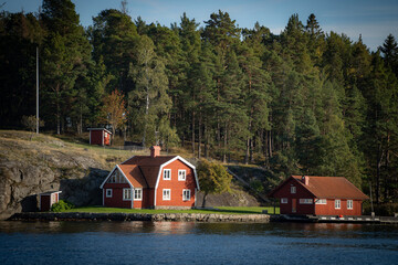 Old traditional red fisherman summer house in Sweden. scandinavian background