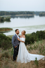 bride and groom on in the woods