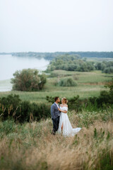 bride and groom on in the woods