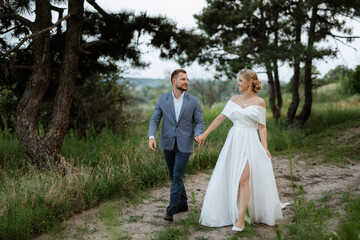 bride and groom on in the woods