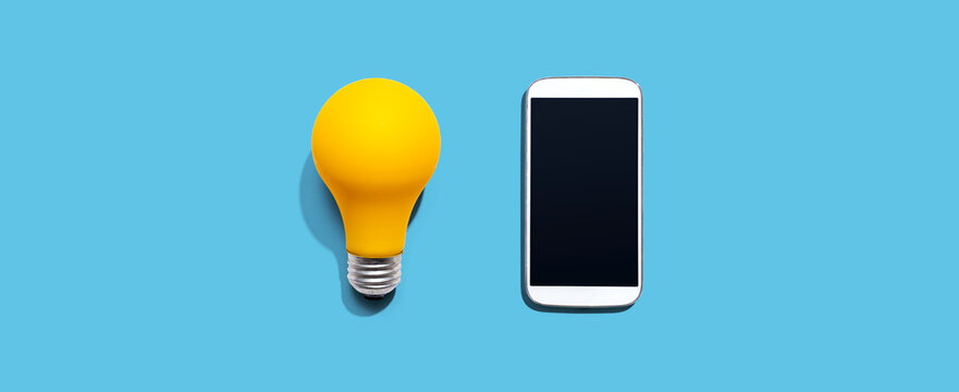 Smartphone with a yellow light bulb from above