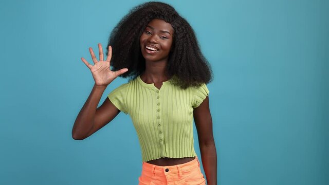 Lady show palm ten fingers numbers isolated blue color background