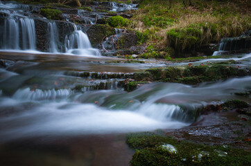 Wild brook with stones and waterfall in Jeseniky mountains, Eastern Europe, Moravia. Clean fresh cold watter, water stream. Long exposure image. .