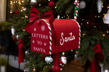 Santa Claus mailbox and gift with bow and ribbons. Gift for Christmas.