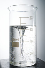 Chemical measure flask with liquid