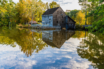 Historic Yates Grist Mill Reflecting in Yates Mill Pond,  Raleigh, North Carolina, USA © Billy McDonald
