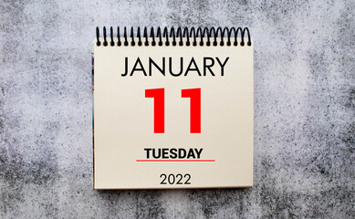 Save the Date written on a calendar - January 11 - Nicht vergessen in german