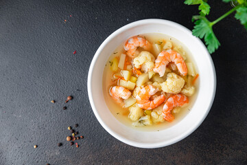 shrimp soup vegetables seafood first course healthy meal diet snack on the table copy space food background rustic. top view keto or paleo diet pescetarian