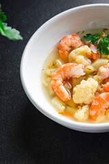 shrimp soup vegetables seafood first course healthy meal diet snack on the table copy space food background rustic. top view keto or paleo diet pescetarian