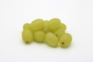 Close-up of twelve grapes together isolated on a white background