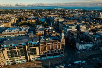 Edinburgh sunlight breathtaking view of the Georgian architecture of the Capital of Scotland. Edinburgh train station zips through fields, through Scottish farmland