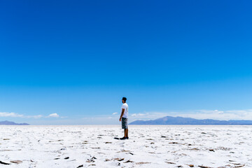 person in the middle of salt desert