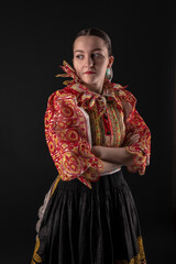 Young beautiful slovak woman in traditional dress. Slovak folklore