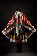 Young beautiful slovak woman in traditional dress. Slovak folklore