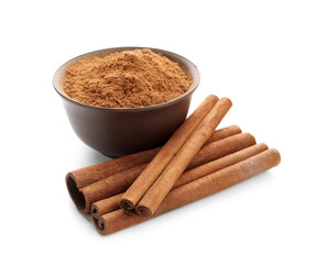 Bowl with natural cinnamon powder and sticks on white background