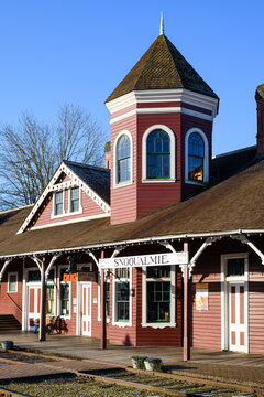 Snoqualmie, WA, USA - April 11, 2021; Northwest Railway Museum Historic Depot In Downtown Snoqualmie Washington With The Red Painted Wooden Building Standing In Downtown Under Blue Sky