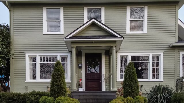 4k dolly approach shot of a modern American suburban home