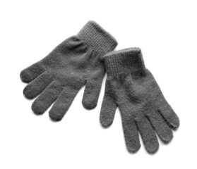 Pair of warm gloves on white background