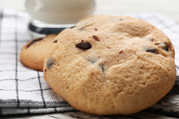 Tasty homemade cookies with chocolate chips on table, closeup