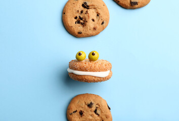 Funny cookies on color background