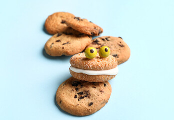 Funny cookies on color background