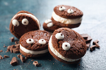 Funny chocolate cookies on dark background