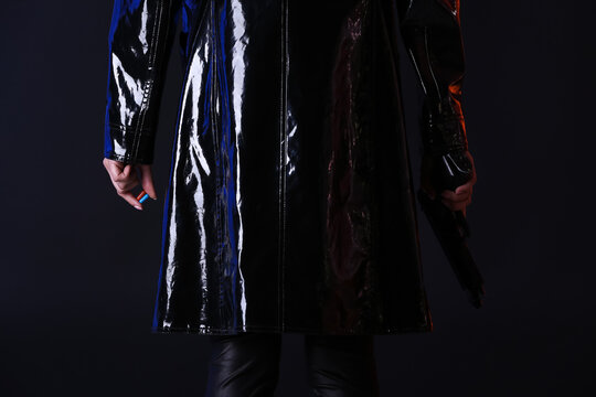 Woman with blue and red pills on dark background. Concept of choice