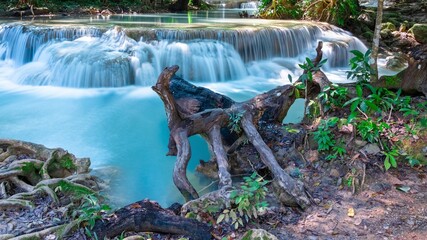 Erawan waterfalls in the national park mountains of Kanchanaburi BKK Bangkok Thailand lovely turquoise blue creamy waters lush green trees smooth rock formations