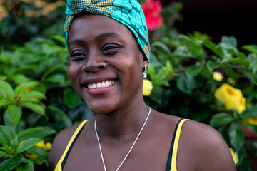Close up portrait of attractive african american woman with beautiful big smile , wearing...