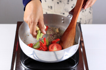 Female Hand Add Lemongrass to the Pan, Cooking Backstage Making South Asian Menu, Like Pindang...