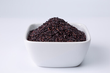 riceberry rice in a white bowl on white background