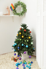 Beautiful decorated Christmas tree in room. LGBT concept