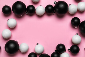 Frame made of different Christmas balls on pink background, closeup