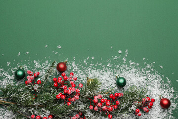 Beautiful composition with fir branch, Christmas decorations and snow on color background