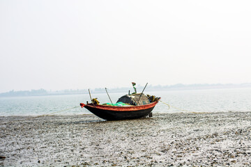 Native fishing boat has been anchored on beach