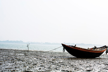 Obraz premium Native fishing boat has been anchored on beach