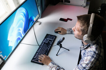 call center manager making a voice chat call to the client using computer in the office