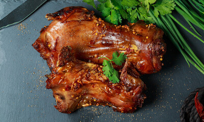 Homemade roast rat, Steak knife, fork, dipping sauce, steak knife, potato wedges top view on a slate board with dark gray color paint, old crumpled paper. Horizontal top view from above,grilled rats.
