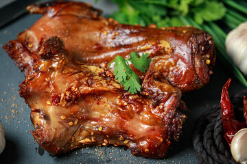Homemade roast rat, Steak knife, fork, dipping sauce, steak knife, potato wedges top view on a...