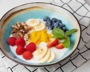 Porridge with fruits, berries, nuts.