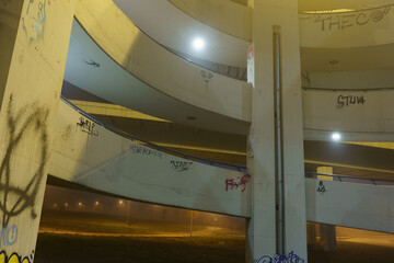 street lights under a concrete bridge in the fog in the city of Prague at night 2021