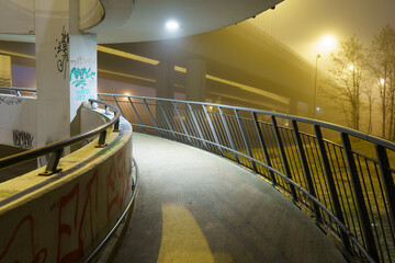 street lights under a concrete bridge in the fog in the city of Prague at night 2021