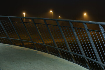 street lights under a concrete bridge in the fog in the city of Prague at night 2021