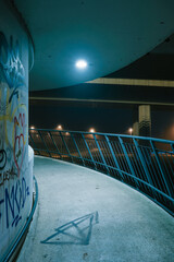 street lights under a concrete bridge in the fog in the city of Prague at night 2021