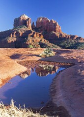 Scenic Vertical Landscape View of Iconic Cathedral Rock from Secret Slickrock Hiking Trail near Crescent Moon Ranch in Red Rock State Park, Sedona Arizona