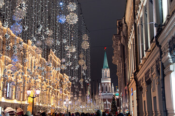 Christmas and New Year's Moscow. Nikolskaya Street at night with a view of the Kremlin. Night festive city.