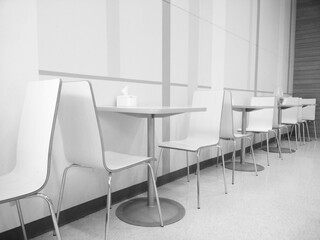 Tables and chairs in black and white tones